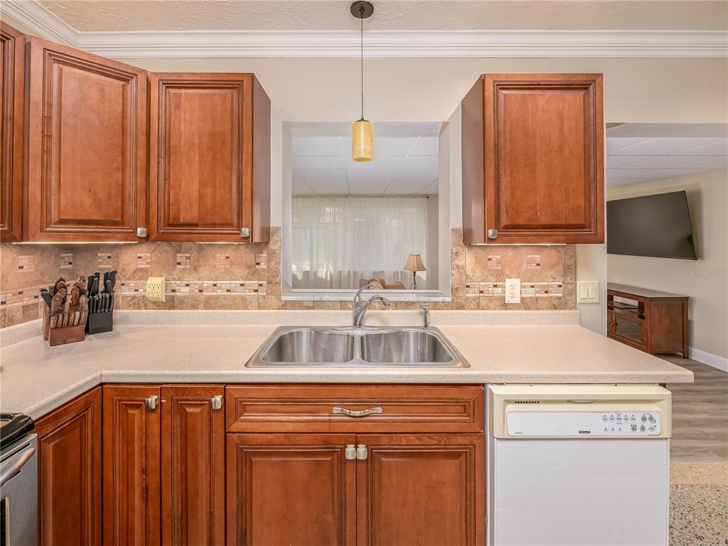 907 Hillside Terrace Brandon, FL 33511 - Photo 10 of 35 a kitchen with a cabinets and white appliances