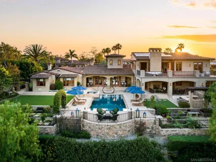 a aerial view of multiple houses with a yard