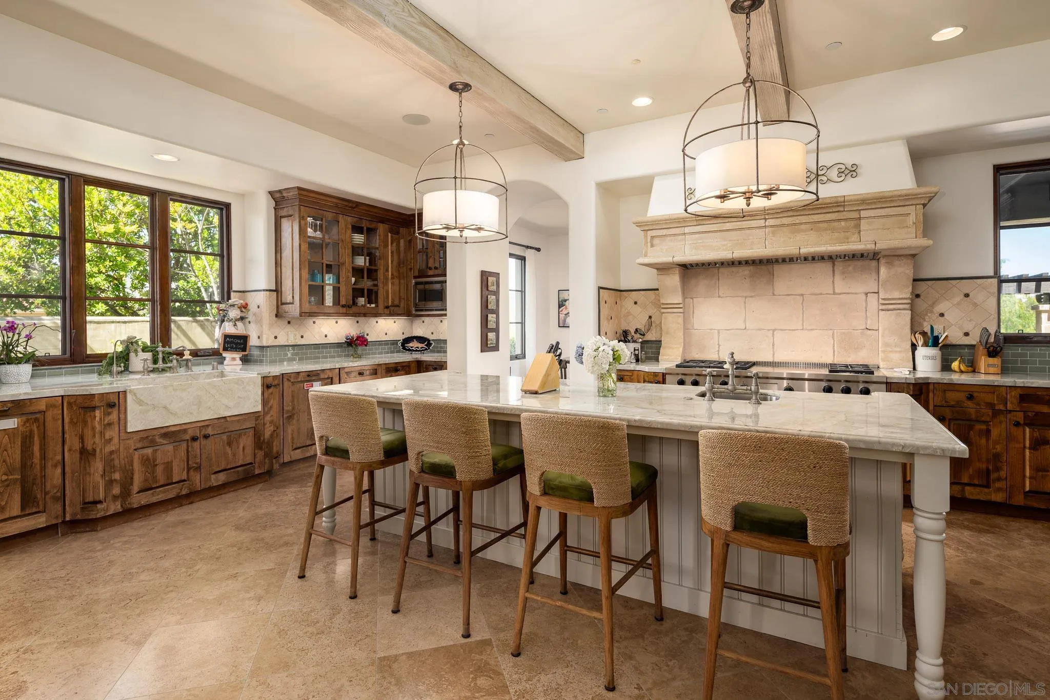 8053 High Time Ridge San Diego, CA 92127 - Photo 19 of 62 a large kitchen with a table and chairs