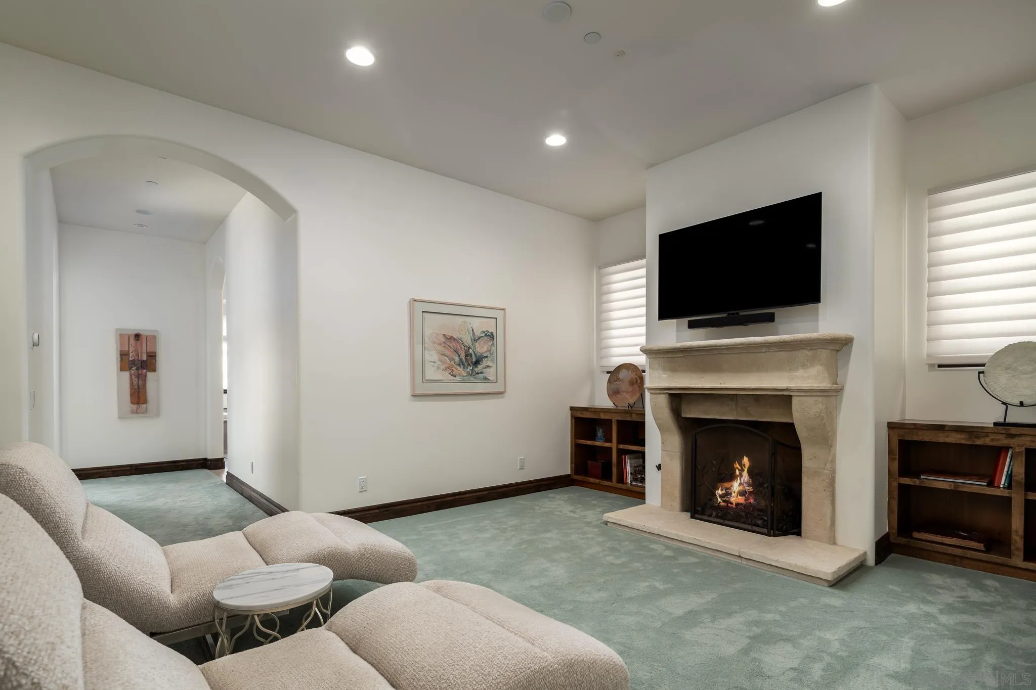 8053 High Time Ridge San Diego, CA 92127 - Photo 28 of 62 a living room with furniture a flat screen tv and a fireplace