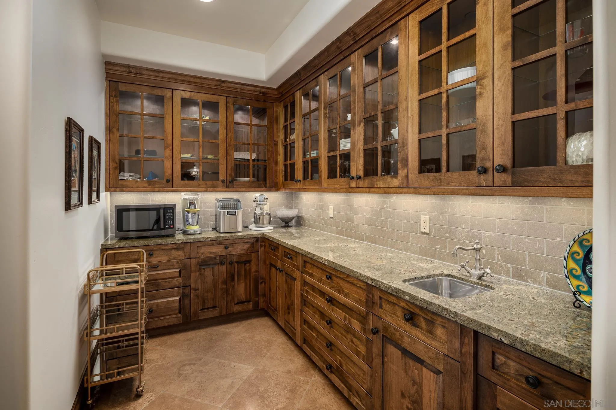8053 High Time Ridge San Diego, CA 92127 - Photo 32 of 62 a kitchen with stainless steel appliances a sink and cabinets