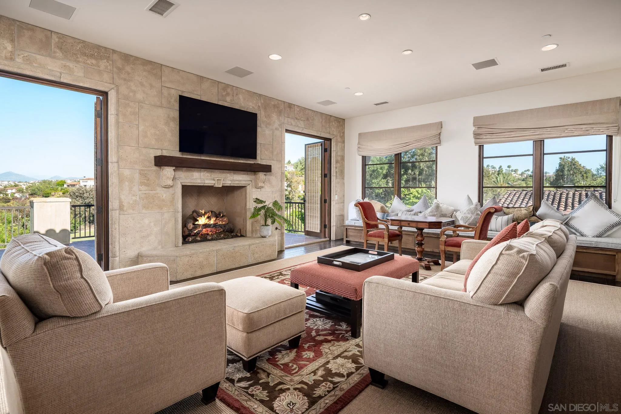 8053 High Time Ridge San Diego, CA 92127 - Photo 34 of 62 a living room with furniture fireplace and a flat screen tv