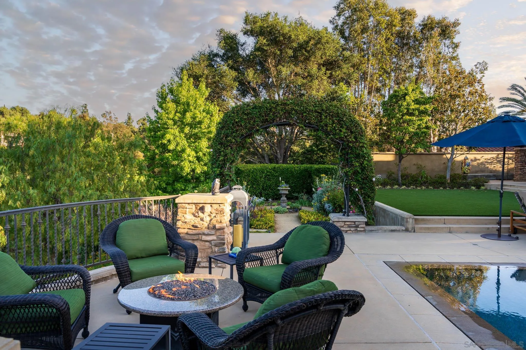 8053 High Time Ridge San Diego, CA 92127 - Photo 44 of 62 a view of a patio with couches chairs and a fire pit