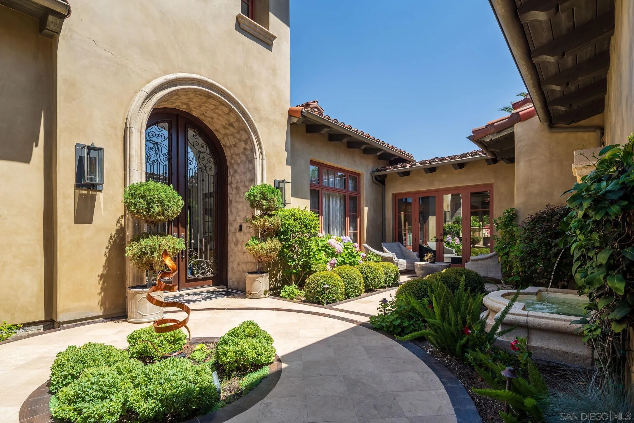 8053 High Time Ridge San Diego, CA 92127 - Photo 47 of 62 a front view of a house with garden