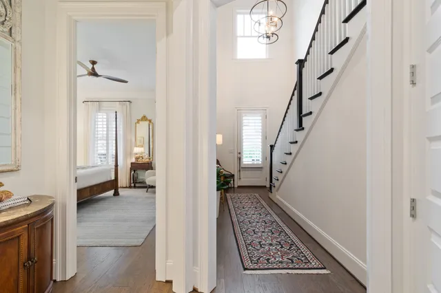 a bedroom with a bed dresser and a window