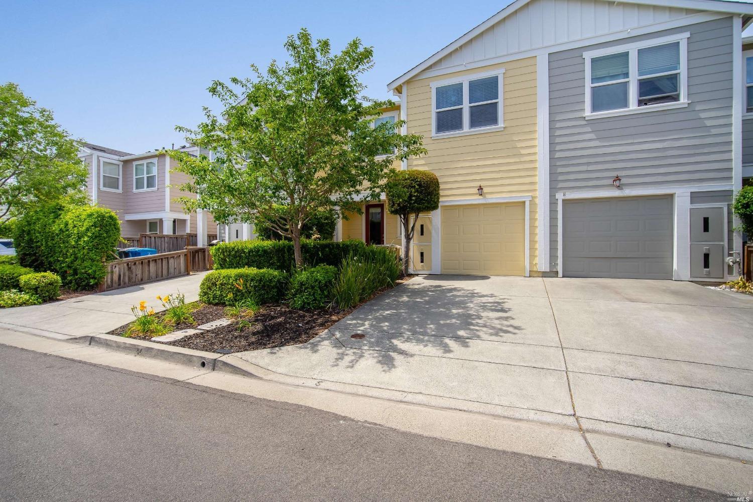 924 Aston Avenue Santa Rosa, CA 95404 - Photo 1 of 1 a front view of a house with a yard and a garage