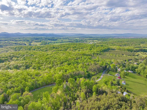 a view of lake with green space