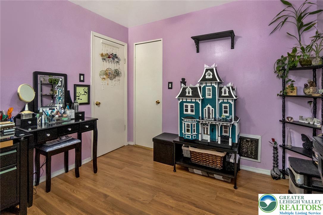 365 Rock Street Easton, PA 18042 - Photo 29 of 50 Laminate flooring extends throughout this versatile bedroom, featuring two accessible closets for convenience.
