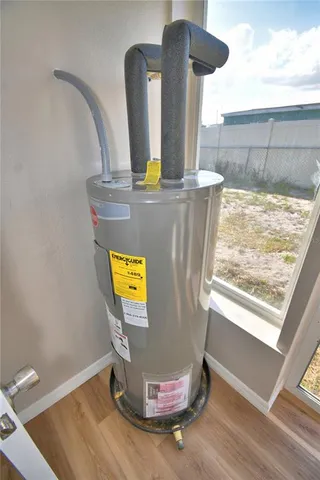 a view of room with window and hardwood floor