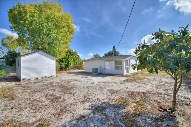 a backyard of a house with lots of green space