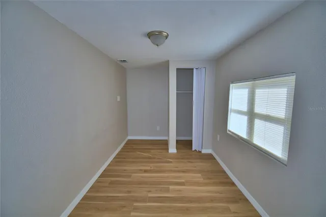 a view of a house with a yard and garage