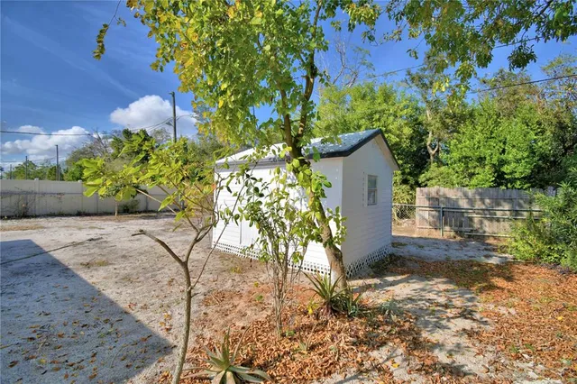 a house with trees in the background