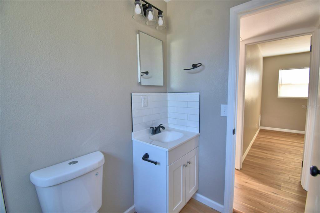 108 Yale Avenue Frostproof, FL 33843 - Photo 9 of 42 a bathroom with a sink toilet and shower