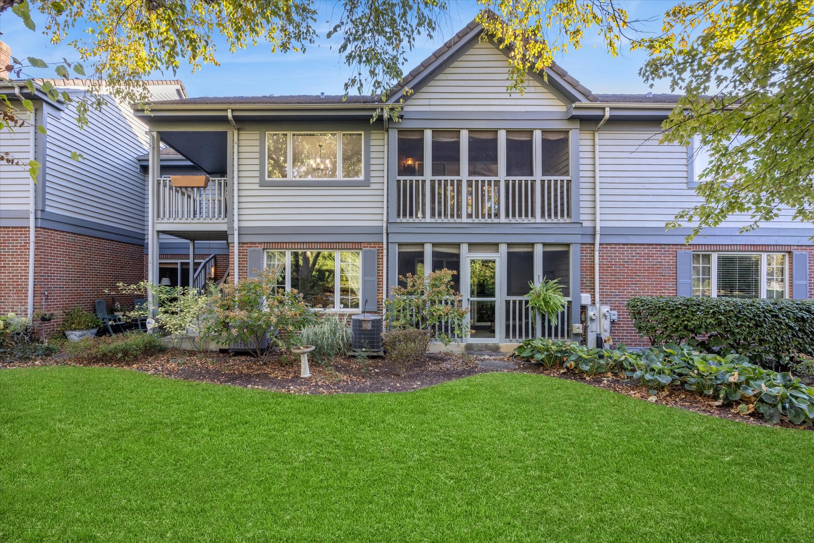 179 Foxborough Place Burr Ridge, IL 60527 - Photo 15 of 18 a front view of a house with a yard and porch