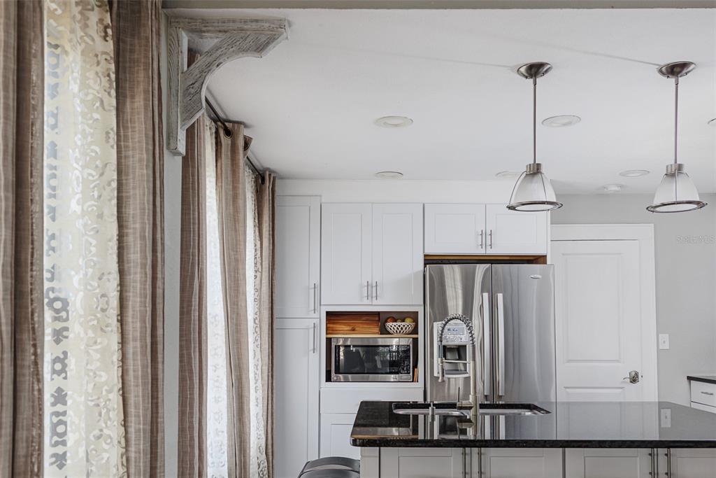 749 South Rushing Avenue Lakeland, FL 33801 - Photo 13 of 45 a view of a entryway with furniture and floor to ceiling window
