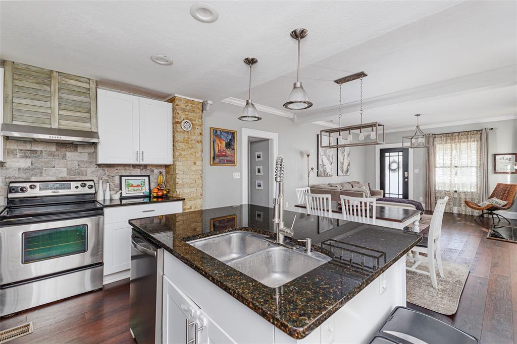 749 South Rushing Avenue Lakeland, FL 33801 - Photo 14 of 45 a kitchen with granite countertop a sink a counter space appliances and cabinets