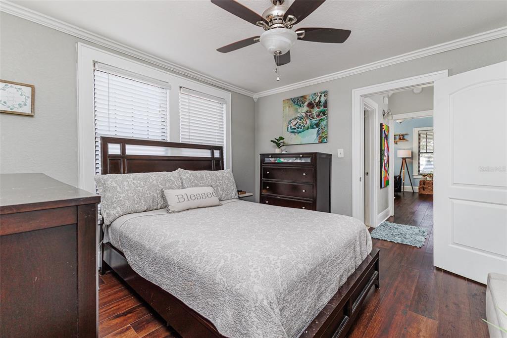 749 South Rushing Avenue Lakeland, FL 33801 - Photo 17 of 45 a bedroom with a large bed and a chandelier