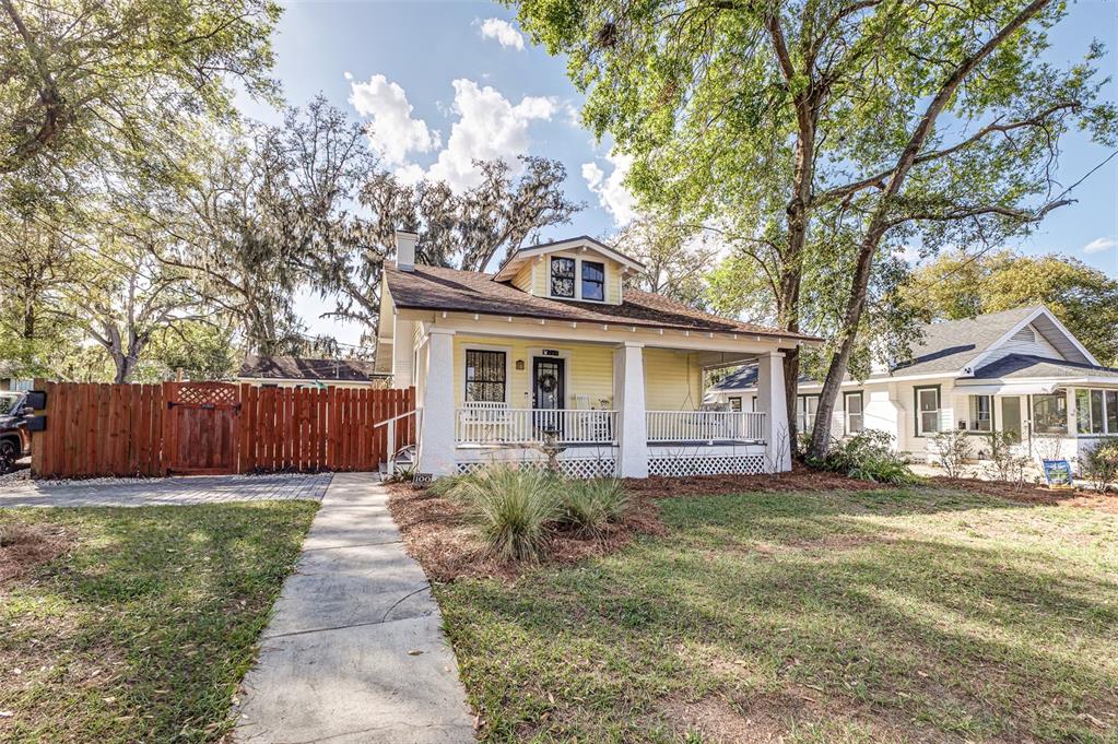 749 South Rushing Avenue Lakeland, FL 33801 - Photo 2 of 45 a front view of a house with a yard and trees