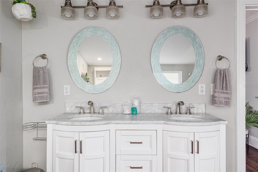 749 South Rushing Avenue Lakeland, FL 33801 - Photo 21 of 45 a bathroom with a double vanity sink and a mirror