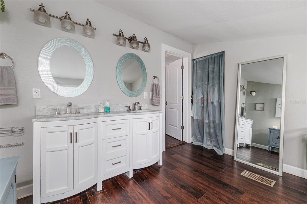 749 South Rushing Avenue Lakeland, FL 33801 - Photo 22 of 45 a bathroom with a granite countertop double vanity sink and mirror