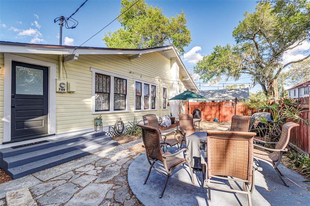 749 South Rushing Avenue Lakeland, FL 33801 - Photo 29 of 45 a backyard of a house with table and chairs
