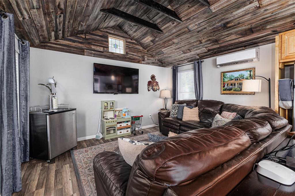 749 South Rushing Avenue Lakeland, FL 33801 - Photo 35 of 45 a living room with furniture and a flat screen tv