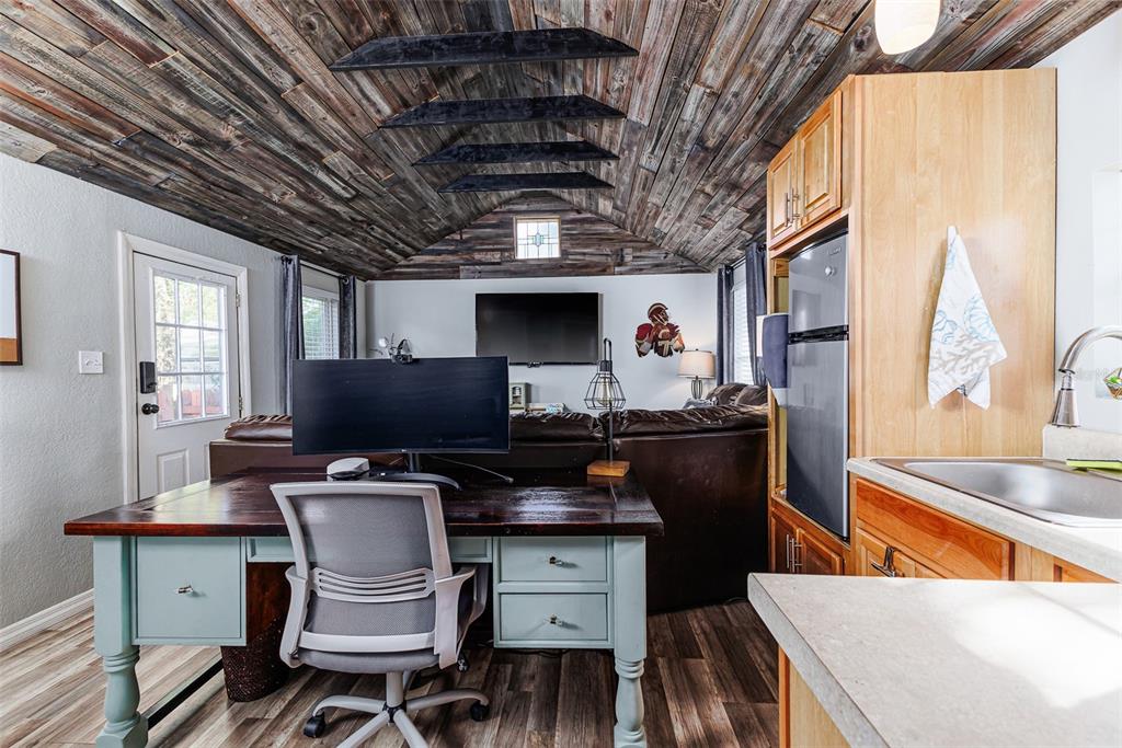 749 South Rushing Avenue Lakeland, FL 33801 - Photo 38 of 45 a kitchen with a sink a stove and chairs