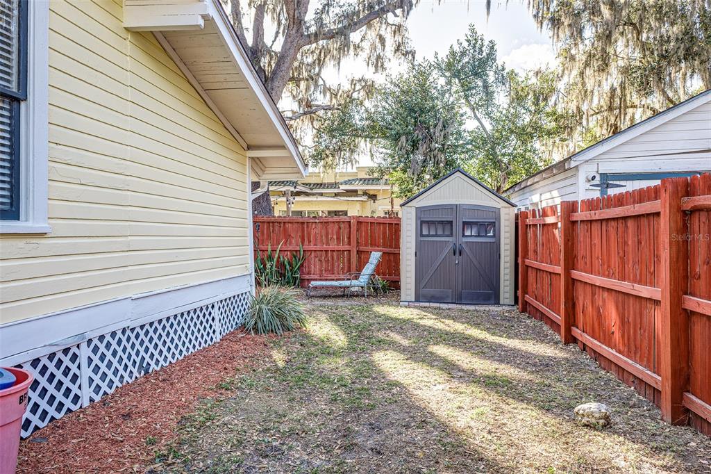 749 South Rushing Avenue Lakeland, FL 33801 - Photo 45 of 45 a view of a house with a small yard and wooden fence