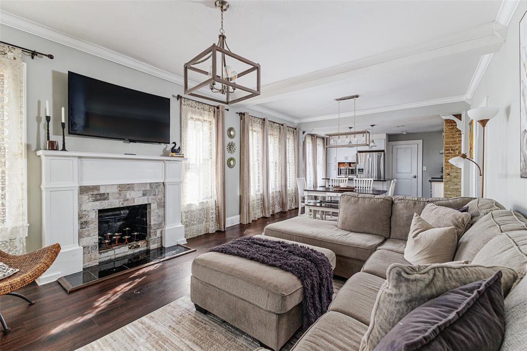 749 South Rushing Avenue Lakeland, FL 33801 - Photo 6 of 45 a living room with furniture fireplace and flat screen tv