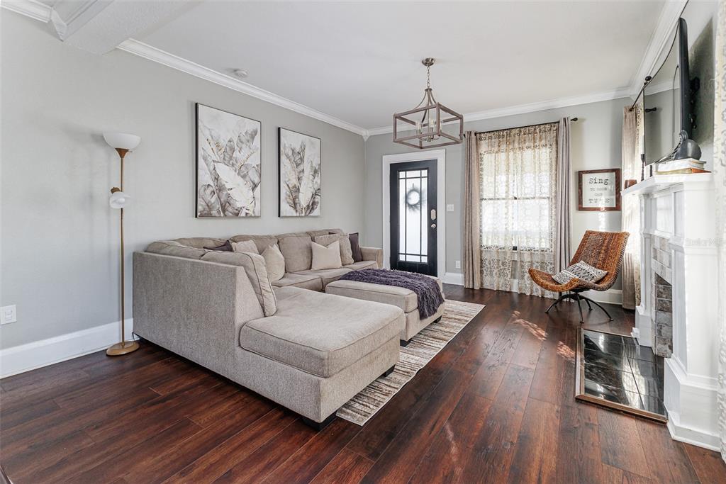 749 South Rushing Avenue Lakeland, FL 33801 - Photo 9 of 45 a living room with furniture fireplace and flat screen tv