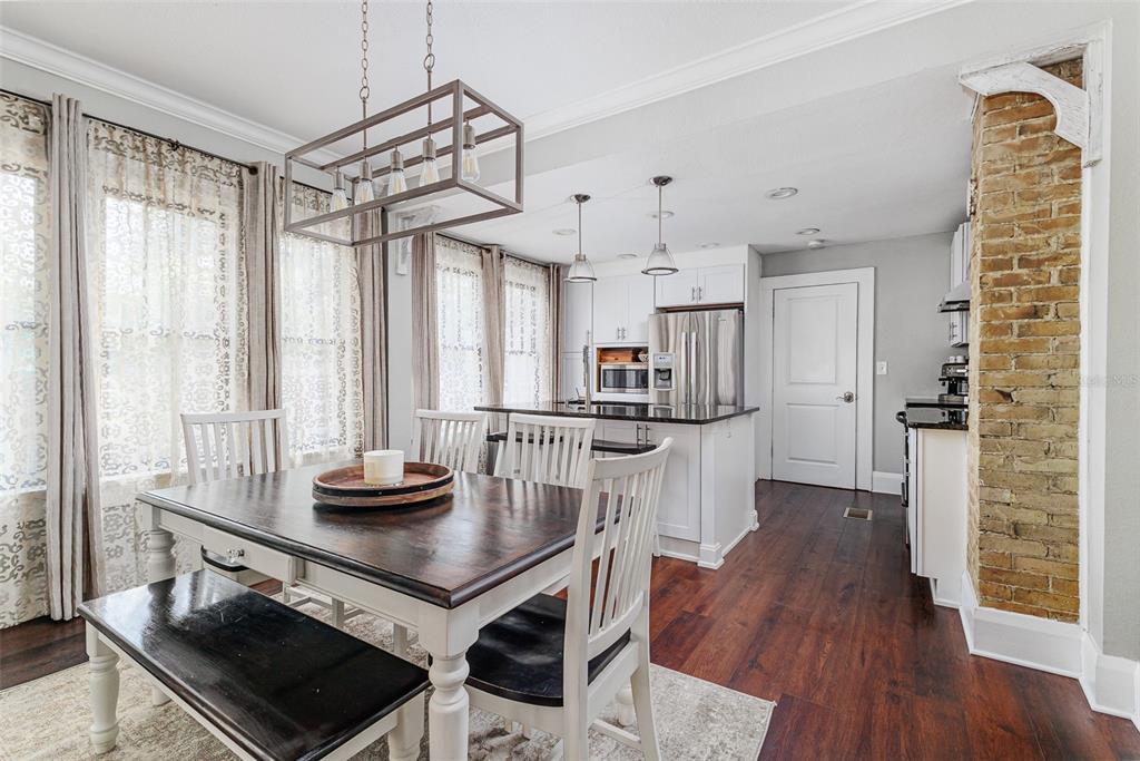 749 South Rushing Avenue Lakeland, FL 33801 - Photo 10 of 45 a kitchen with stainless steel appliances a table and chairs in it