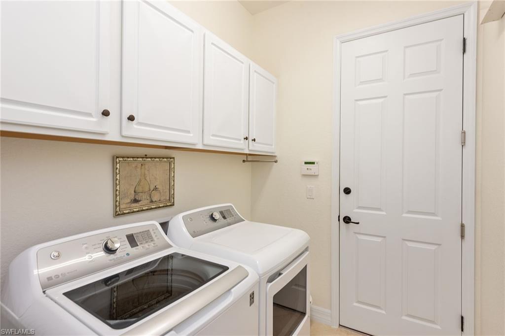 2806 Aviamar Circle Naples, FL 34114 - Photo 18 of 50 a utility room with dryer and washer