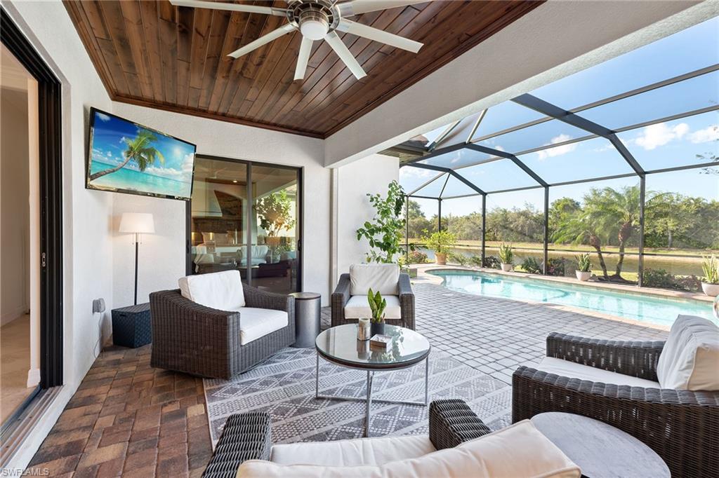 2806 Aviamar Circle Naples, FL 34114 - Photo 19 of 50 a living room with furniture and a large window