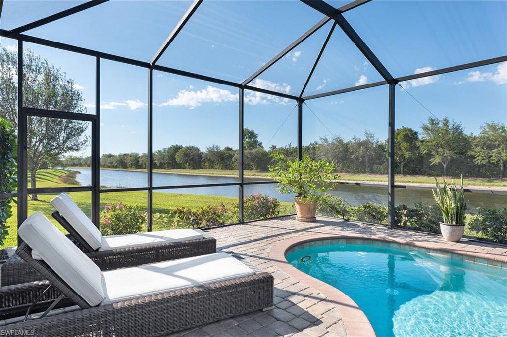 2806 Aviamar Circle Naples, FL 34114 - Photo 22 of 50 a view of a two tub sitting area with swimming pool
