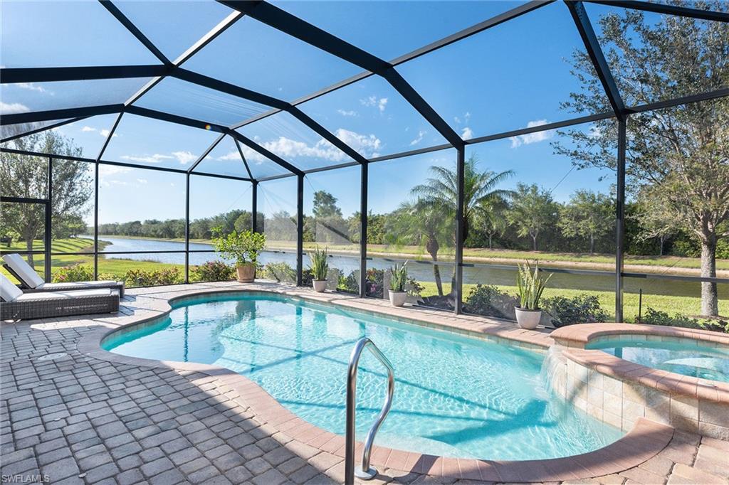 2806 Aviamar Circle Naples, FL 34114 - Photo 23 of 50 a view of a swimming pool with a sitting area