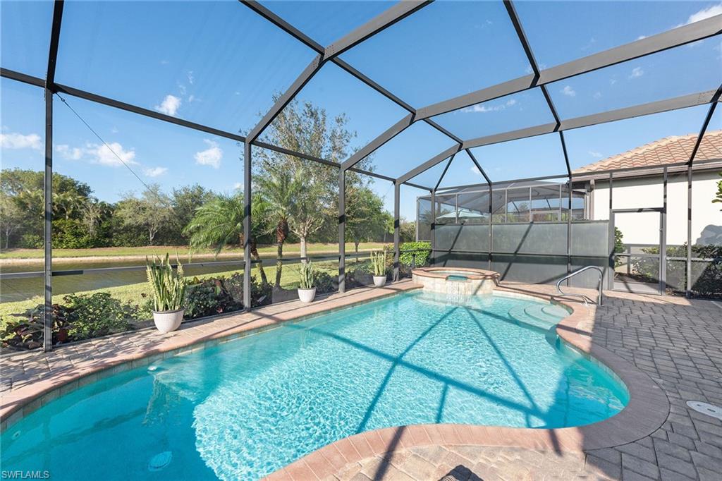 2806 Aviamar Circle Naples, FL 34114 - Photo 24 of 50 a view of a swimming pool with a patio