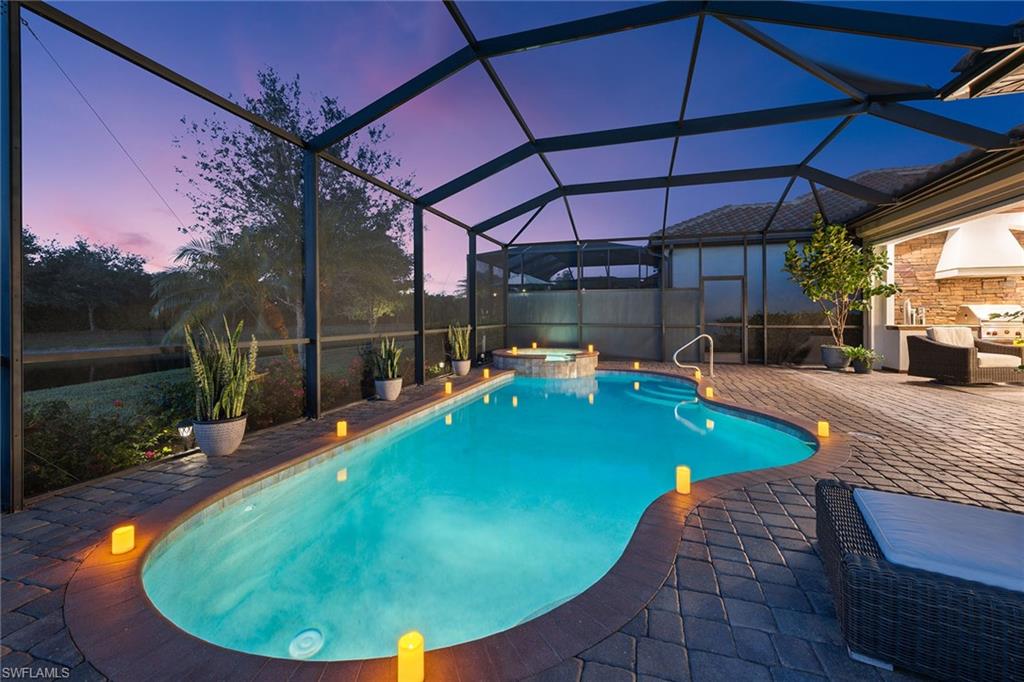 2806 Aviamar Circle Naples, FL 34114 - Photo 26 of 50 a view of a swimming pool with a patio