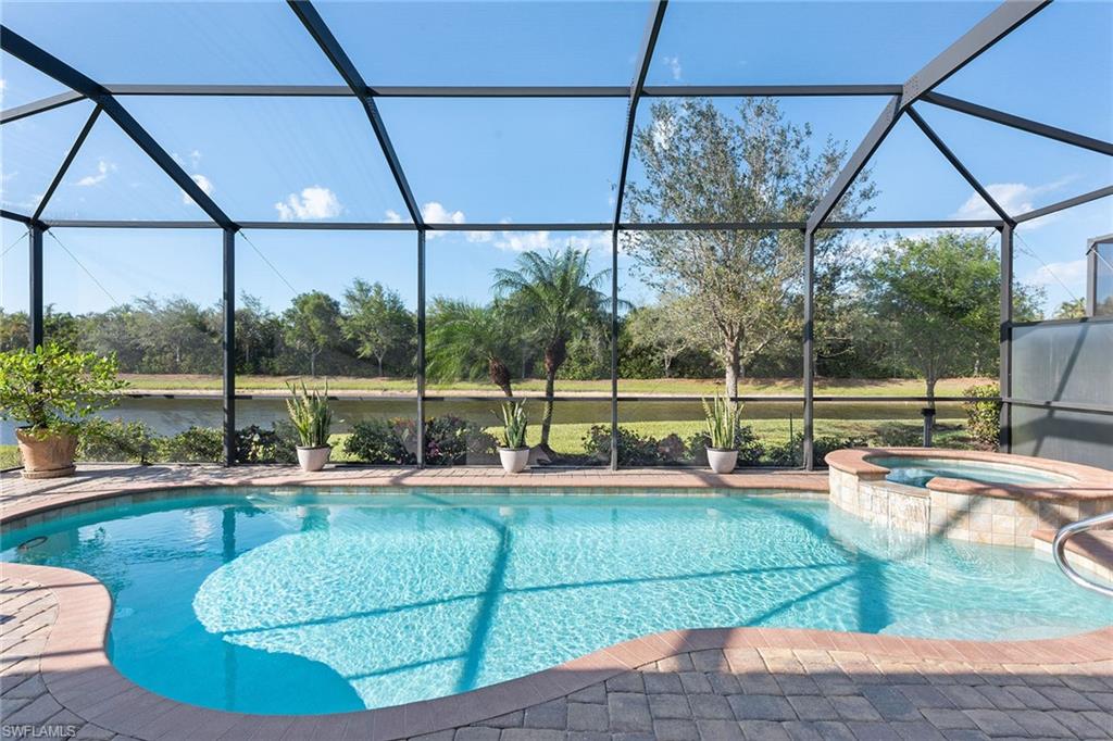 2806 Aviamar Circle Naples, FL 34114 - Photo 27 of 50 a view of a backyard with swimming pool
