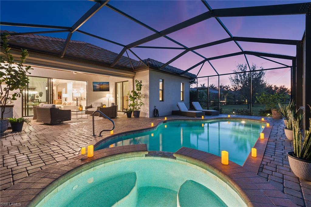 2806 Aviamar Circle Naples, FL 34114 - Photo 28 of 50 a view of a swimming pool with a patio