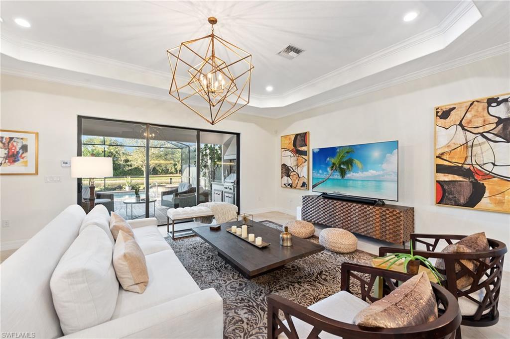 2806 Aviamar Circle Naples, FL 34114 - Photo 3 of 50 a living room with furniture and a large window