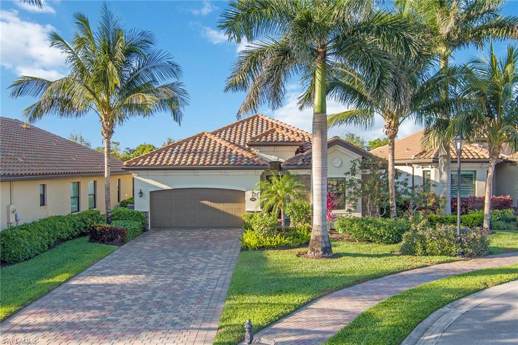 2806 Aviamar Circle Naples, FL 34114 - Photo 31 of 50 a front view of house with yard and green space
