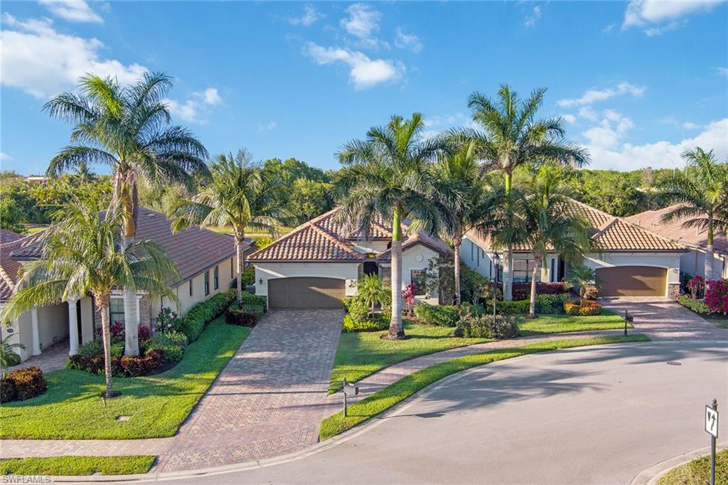 2806 Aviamar Circle Naples, FL 34114 - Photo 33 of 50 a front view of house with yard and green space