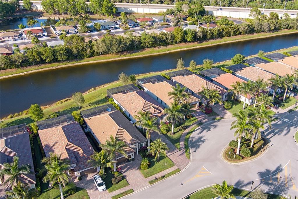 2806 Aviamar Circle Naples, FL 34114 - Photo 36 of 50 an aerial view of residential houses with outdoor space and lake view