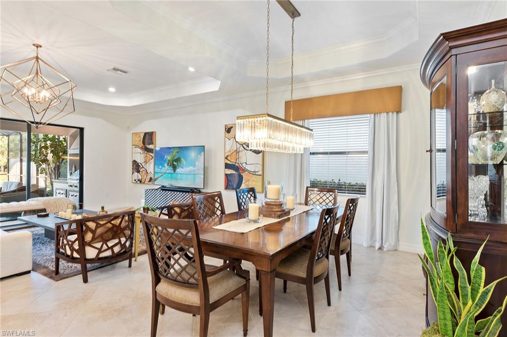 2806 Aviamar Circle Naples, FL 34114 - Photo 7 of 50 a view of a dining room with furniture window and outside view