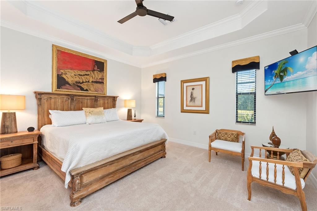 2806 Aviamar Circle Naples, FL 34114 - Photo 9 of 50 a bedroom with a bed and lamp