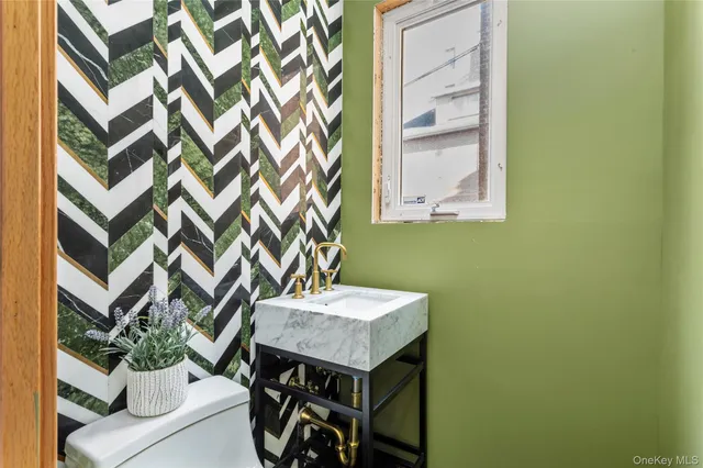 a bathroom with a sink a vanity and a mirror