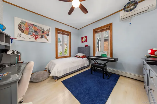 a bedroom with a bed dresser and a window