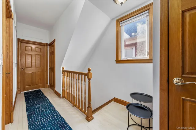 a view of a hallway with entryway door