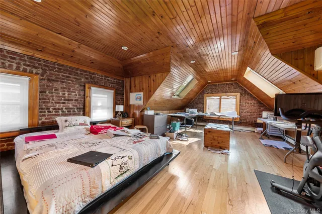 a bedroom with bed or furniture and a wooden floor