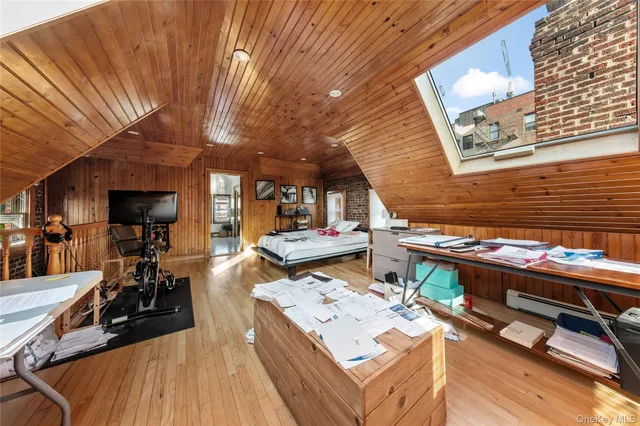 a view of a patio with table and chairs barbeque potted plants and large tree